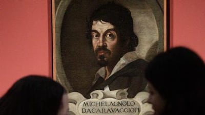Visitors admire the portrait of Caravaggio by an unknown painter during the presentation to journalists of an exhibit dedicated to the Lombard painter in Rome. AP Photo