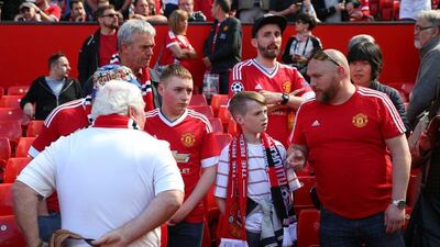 MANCHESTER, ENGLAND - MAY 15: Fans wait in the ground as parts are evacuated shortly before the game was abandoned prior to the Barclays Premier League match between Manchester United and AFC Bournemouth at Old Trafford on May 15, 2016 in Manchester, England. (Photo by Alex Livesey/Getty Images)