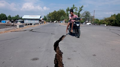 A crack on a road caused by the powerful quake that rocked eastern Indonesia. EPA