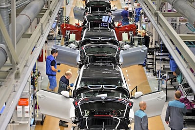 Electric cars are assembled by BMW workers in Leipzig, Germany. EPA