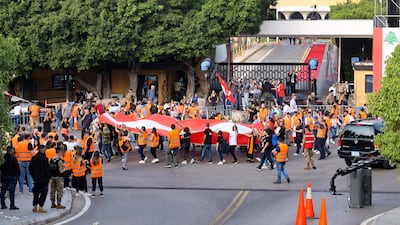 Lebanon's President Michel Aoun leaves the palace in Baabda on Sunday afternoon. Before his departure he signed a broad government resignation decree. AFP