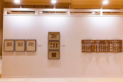 Asma Belhamar’s Visions on the Periphery, right, is a sculpture made from beech-wood. Antonie Robertson / The National