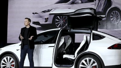Tesla Motors' chief executive Elon Musk unveils the falcon wing door on the Model X electric 4x4. The 'offroader' outpaces the McLaren 675LT. Stephen Lam / Reuters