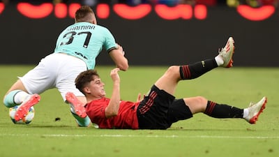 Daniel James hits the turf challenging Inter's Milan Skriniar. AFP