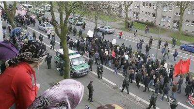 Women in Duisburg watch ademonstration of the right wing NPD, which demands no mosques for Germany.