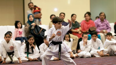 Sukrat Badrieh, 6, demonstrates his karate skills after receiving the black belt, in Abu Dhabi. Ravindranath K / The National