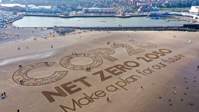 A giant sand artwork adorns New Brighton Beach to highlight global warming and the forthcoming Cop26 global climate conference. Getty Images