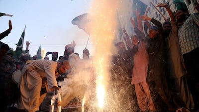 Pakistanis celebrate after Indian fighter jets were shot down. Shahazaib Akber / EPA