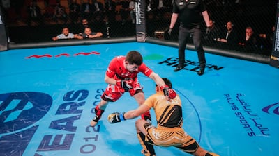 Bagdat Zhubanysh (in yellow) beat Farkhod Rakhmonaliev to win his third IMMAF World Championships gold medal.