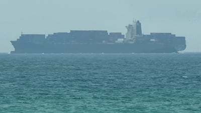 A cargo ship off the eastern coast of the UAE at Khor Fakkan on Sunday. AFP
