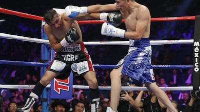 Leo Santa Cruz, right, trades blows with Jose Cayetano during their Mayweather-Pacquiao undercard fight on Saturday night in Las Vegas. John Locher / AP / May 2, 2015