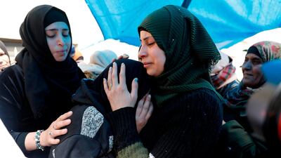 Relatives of 23-year-old Palestinian Mohammed Adwan, who was killed during a clash with Israeli forces near Jerusalem overnight, mourn during his funeral on April 2, 2019. AFP