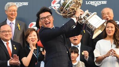 Winning owner Martin Siu Kim Sun holds the cup after Time Warp won Race 8, The Longines Hong Kong Cup during Longines Hong Kong International Race Day in Hong Kong. Vince Caligiuri / Getty Images