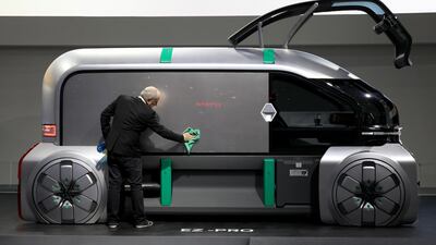 An employee wipes down a Renault EZ-Pro autonomous concept commercial vehicle. SeongJoon Cho / Bloomberg