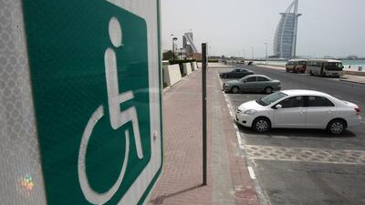 Dubai Police will be cracking down on drivers who park in disabled spaces without a disabled badge. Pawan Singh / The National