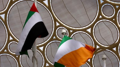 The Irish flag and the UAE flag fly high.