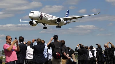 An Airbus A350 in Qatar Airways livery prepares to land after performing in an aerial flying display on the Farnborough International Airshow in July. Paul Thomas / Bloomberg News