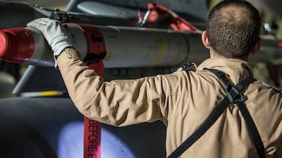 A British Royal Air Force Tornado pilot checking the weapons on his Tornado aircfraft at RAF Akrotiri, Cyprus. AP Photo