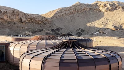 The pods are clad in steel panels, coloured to reference the different hues of the surrounding landscape. Courtesy of Hopkins Architects