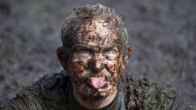 A male entrant takes a dip in the Bog Jacuzzi after participating in the Irish Bog Snorkelling championship on Sunday. Charles McQuillan / Getty Images