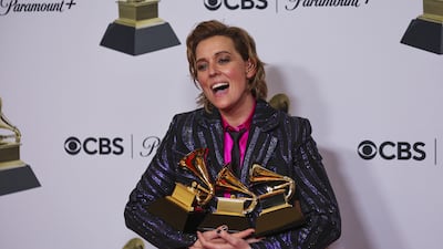 Brandi Carlile with her awards for Best Americana Album, Best Rock Song and Best Rock Performance. Reuters