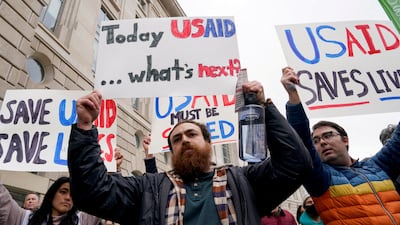 People protest outside the USAID building in Washington against the Trump administration's plans to shut down the agency. Reuters