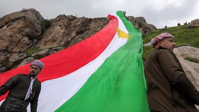 Iraqi Kurds display their flag in Akre. Nowruz is an ancient Zoroastrian tradition celebrated by Iranians and Kurds, which coincides with the vernal equinox and is calculated using the solar calendar. AFP