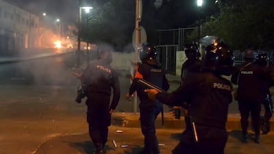 Public security personnel deploy during a protest against a curfew imposed to stem a severe outbreak of the coronavirus disease. Reuters, file