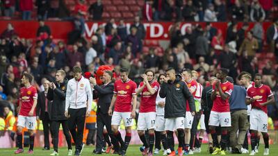 Manchester United players applaud supporters following their last home game of the season, against Arsenal, on Sunday, May 17, 2015. Jon Super / AP Photo
