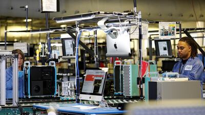 Flextronics International Apple factory employees work on Apple Mac Pro computer assembly. Reuters