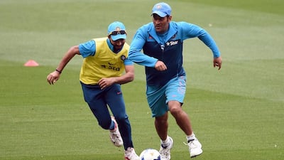 MS Dhoni, right, is the only member of Indian team when they were beaten by Bangladesh in the 2007 World Cup. William West / AFP