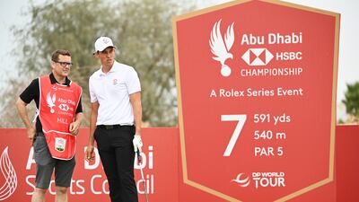 Josh Hill of England looks on with his caddie. Getty Images