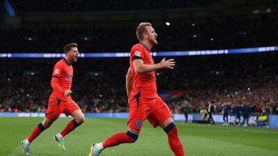 England's Harry Kane celebrates with Mason Mount after scoring the third goal in the 3-3 Nations League draw with Germany at Wembley Stadium on September 26, 2022. Getty