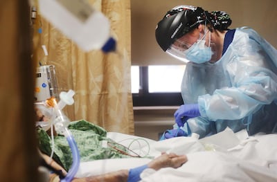 Nurse Katelyn Musslewhite cares for a Covid-19 patient in the Intensive Care Unit (ICU) at Providence St Mary Medical Centre amid a surge in Covid-19 patients in Southern California on December 23. AFP Photo