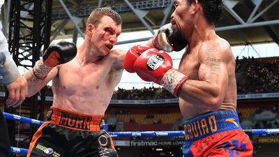 Jeff Horn lands a jab on Manny Pacquiao during their fight in Brisbane on Sunday morning. Dave Hunt / Reuters