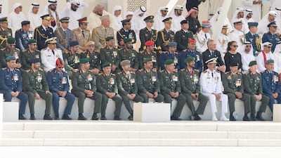 Maj Gen Pilot Sheikh Ahmed bin Tahnoon bin Mohamed, Chairman of the National and Reserve Service Authority (first row, third right), Rear Admiral Pilot Sheikh Saeed bin Hamdan bin Mohamed, Commander of the UAE Naval Forces (first row fourth right), Brig Gen Saleh Mohamed Saleh Al Ameri, Commander of the UAE Ground Forces (1st row fifth right) and members of the UAE Armed Forces and foreign armed forces representatives attend a Commemoration Day ceremony at Wahat Al Karama.