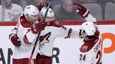 Mikkel Boedker, centre, celebrates with teammates Keith Yandle, left, and Kyle Chipchura after scoring. Not many in Phoenix have been celebrating with them as attendance for Coyotes' games remains poor. Eric Bolte /USA TODAY
