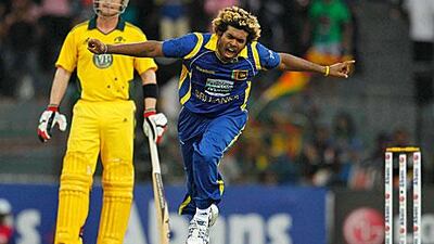 Lasith Malinga celebrates dismissing the Australian batsman Xavier Doherty to complete his third hat-trick. The Australia captain Michael Clarke is glad he will not feature in Tests but is wary of spin threat.