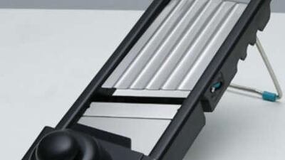 The Cooks Quarters Mandoline slices to within an inch of its life.