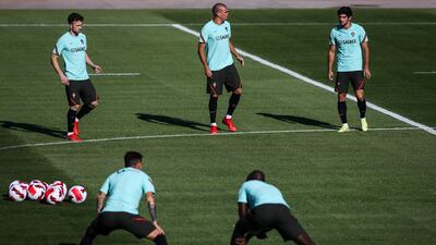 Left to right: Diogo Jota, Pepe and Goncalo Guedes at training. EPA