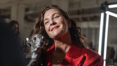 Drew Barrymore holds Tika the Iggy during an interview before viewing Christian Siriano's autumn/winter 2022 fashion collection at New York Fashion Week on Saturday. AP