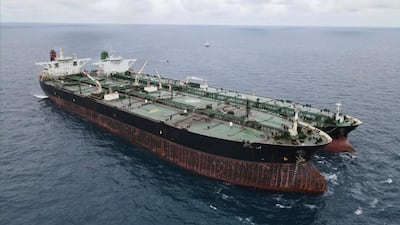 In this photo released by Indonesian Maritime Security Agency (BAKAMLA), Panamanian-flagged MT Frea, left, and Iranian-flagged MT Horse tankers are seen anchored together in Pontianak waters off Borneo island, Indonesia, Sunday, Jan. 24, 2021. Indonesian authorities said that they seized the two vessels suspected of carrying out the illegal transfer of oil in their country's waters. (Indonesian Maritime Security Agency via AP)