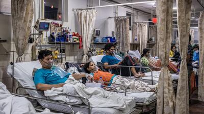 Covid-19 patients inside the emergency ward of a Covid-19 hospital in New Delhi, India. Getty