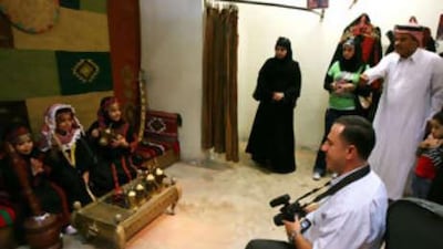 Wearing traditional Bedouin dresses, Abdul Rahman Issa's children pose for a picture in Amman.