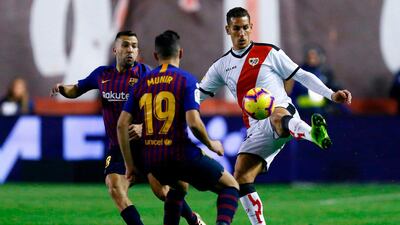 Rayo Vallecano's Alex Alegria challenges Barcelona's Jordi Alba. AFP