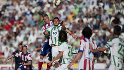 Cordoba, in green, in action against Atletico Madrid on April 4, 2015. Jorge Guerrero / AFP