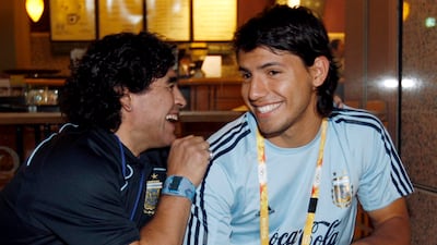 Arentina legend Diego Maradona and Sergio Aguero speak during the 2008 Beijing Olympic Games. EPA