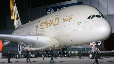 An Airbus A380-800 with the new paint scheme for Etihad Airways stands in front of the paint shop of Airbus's plant in Hamburg Finkenwerder. EPA