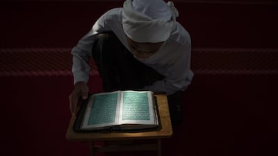 A Malaysian student reads the Quran at a school in Hulu Langat, near Kuala Lumpur on June 30, 2014. Mohd Rasfan/AFP Photo