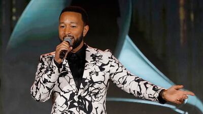 Legend accepts the Global Impact Award during the Recording Academy Honours presented by The Black Music Collective on April 2. AP